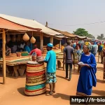 비아프라 전쟁 이후 이그보인의 삶 - A vibrant outdoor market scene in southeastern Nigeria, showcasing Igbo entrepreneurs engaging in sm...